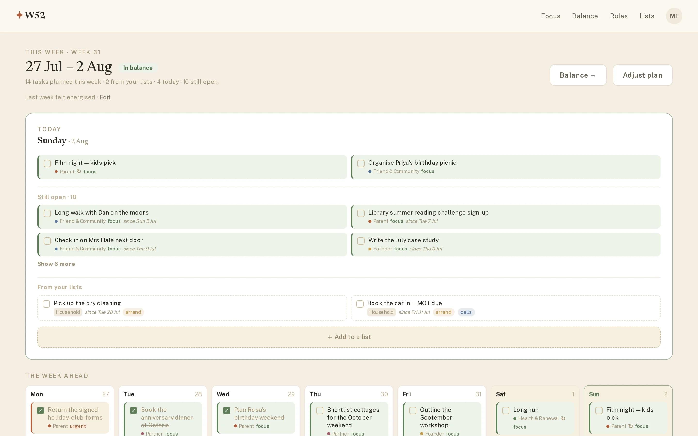 The W52 Focus screen on a Sunday: today's tasks at the top, ten still-open tasks below, dated list items, and the week ahead as a row of days with completed tasks crossed out.